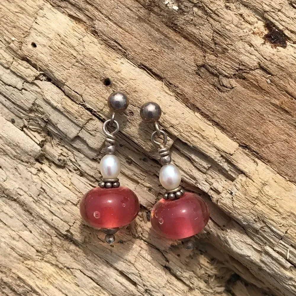 Earrings made with handcrafted blown glass in silver and pink-peach color